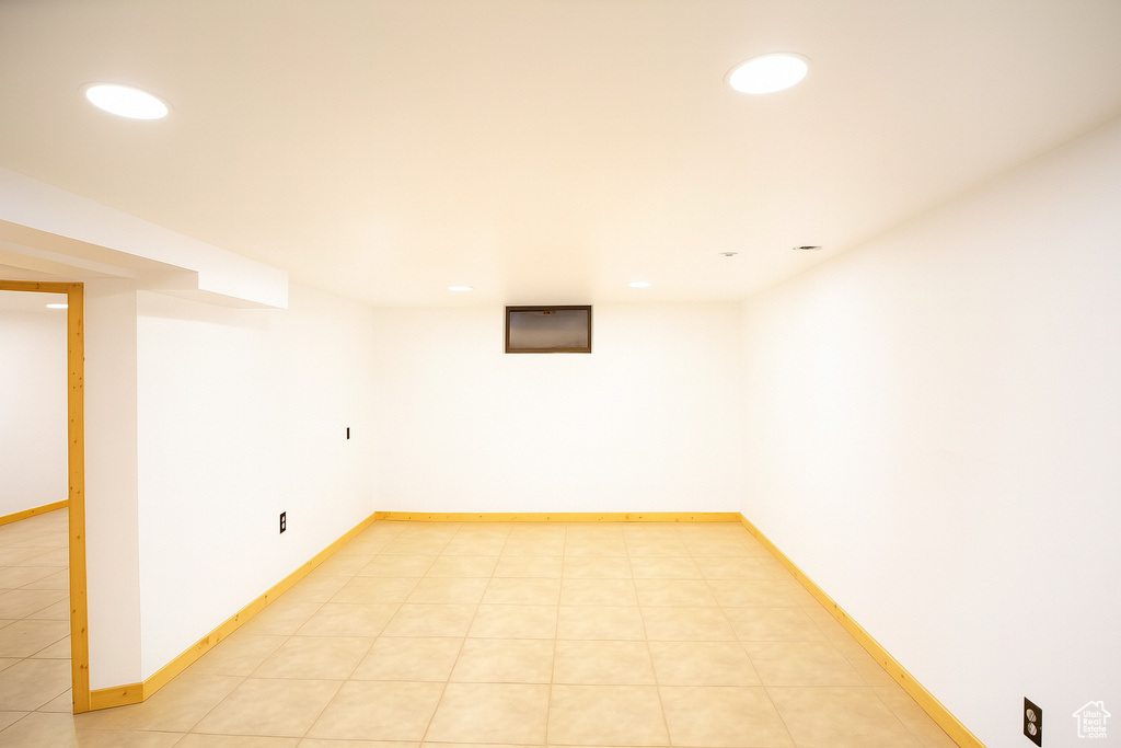 Finished below grade area with recessed lighting and baseboards