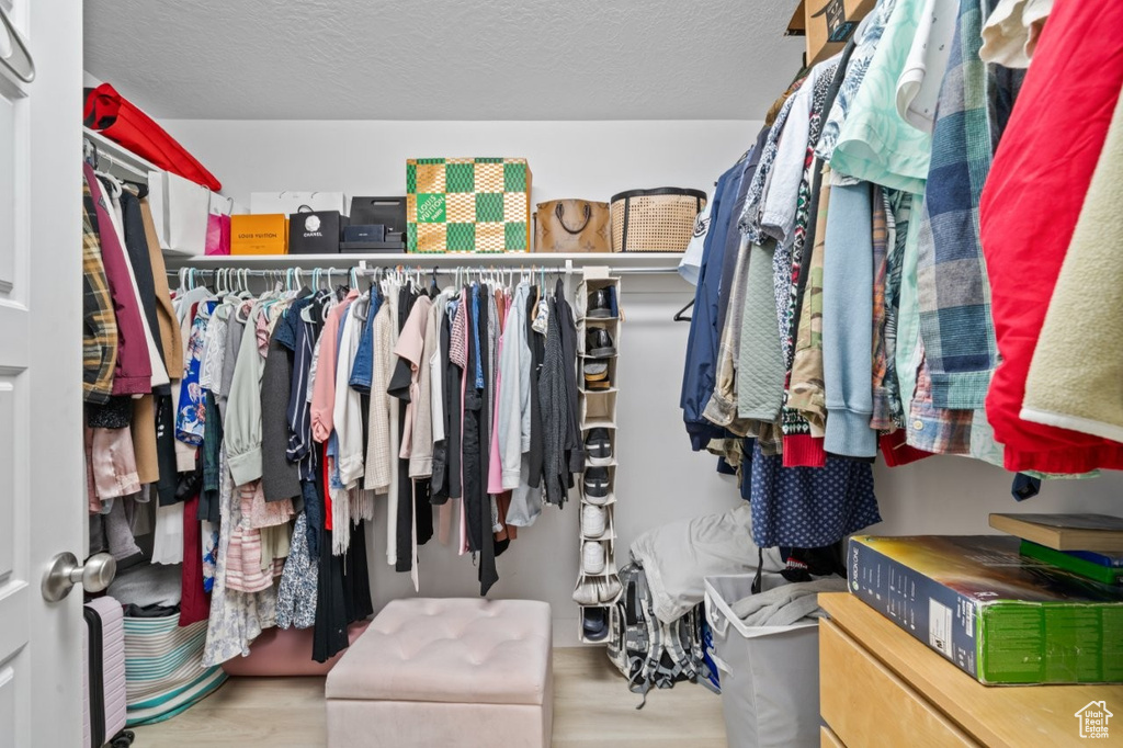 Spacious closet with wood finished floors