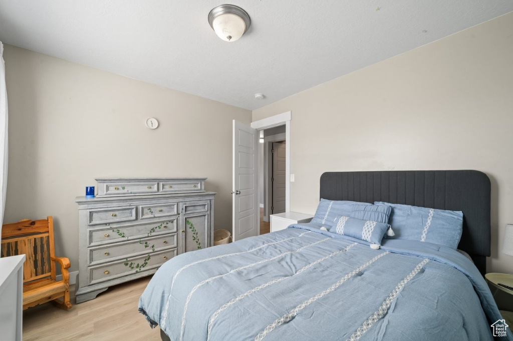 Bedroom with light wood-style floors