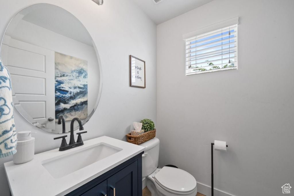 Bathroom featuring toilet and vanity
