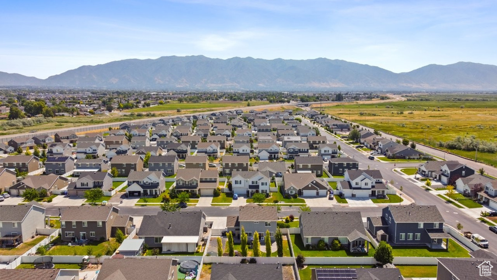 Aerial view of residential area featuring a mountainous background