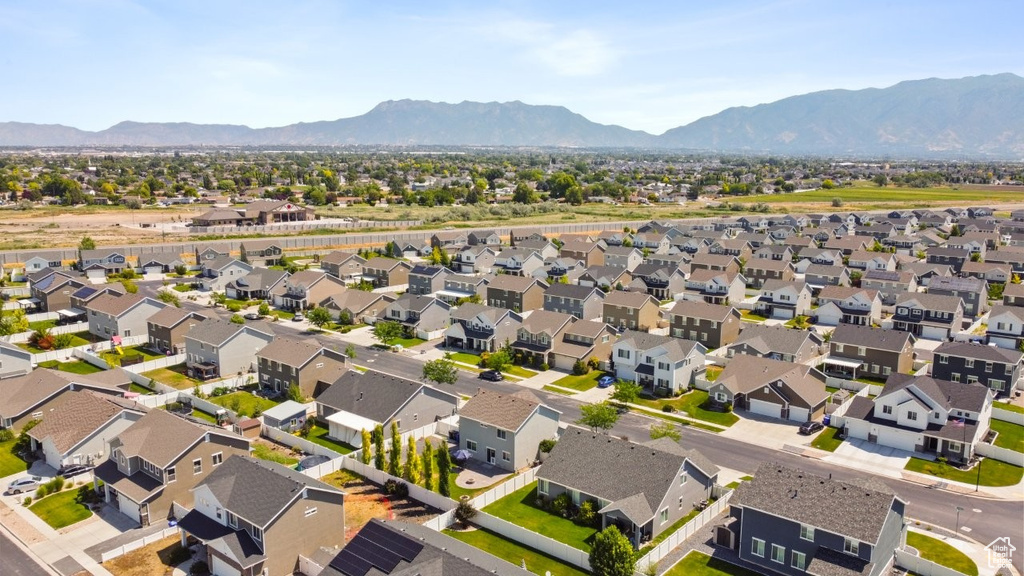 Aerial perspective of suburban area with a mountain backdrop