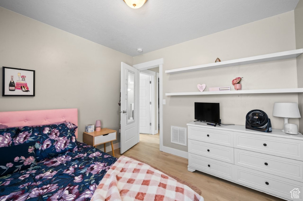 Bedroom featuring light wood finished floors