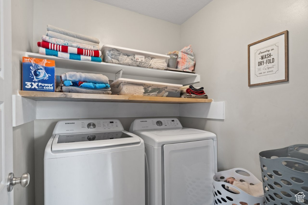 Laundry area featuring separate washer and dryer