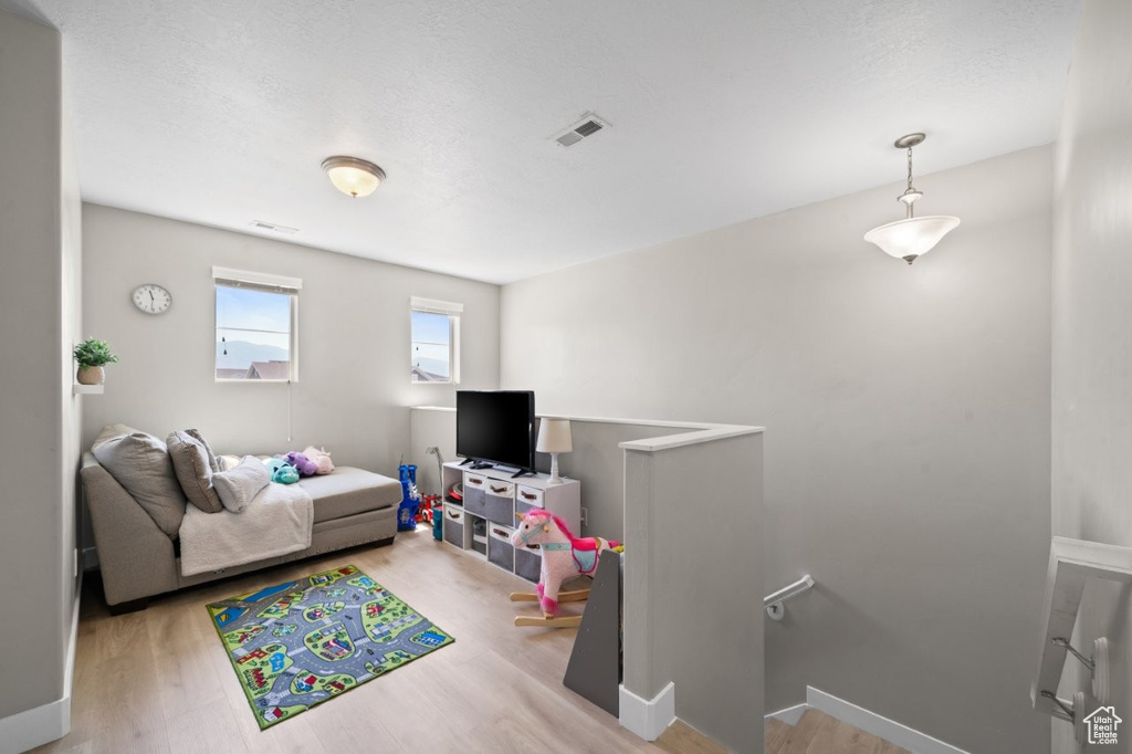 Living room featuring wood finished floors and baseboards