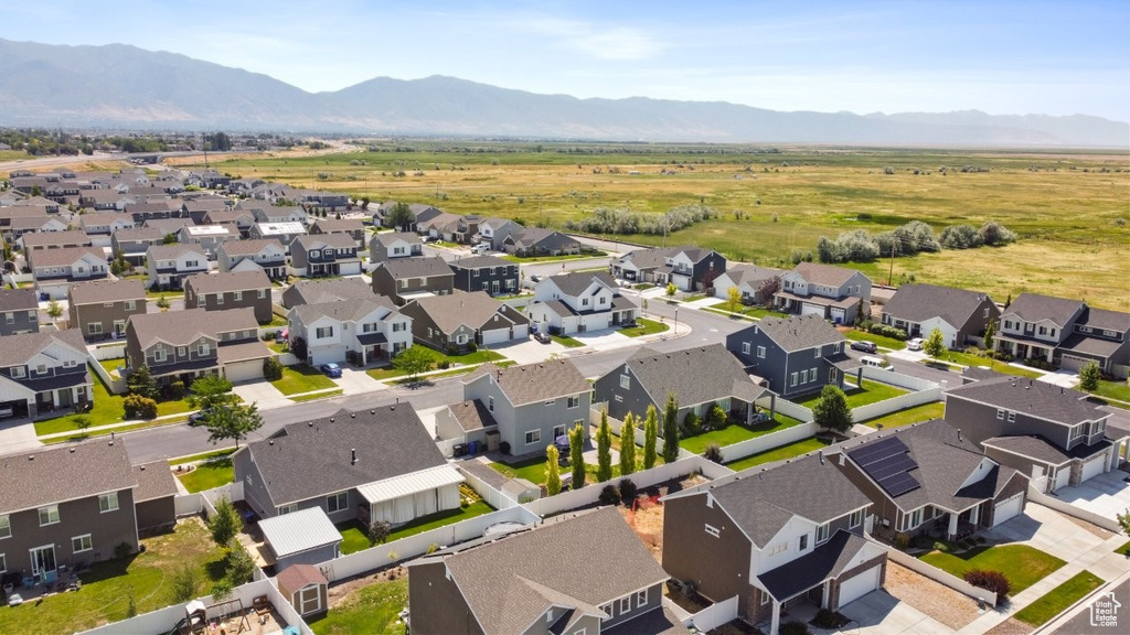 Aerial view of residential area with a mountain backdrop