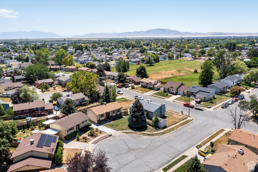 Aerial perspective of suburban area featuring a mountain backdrop