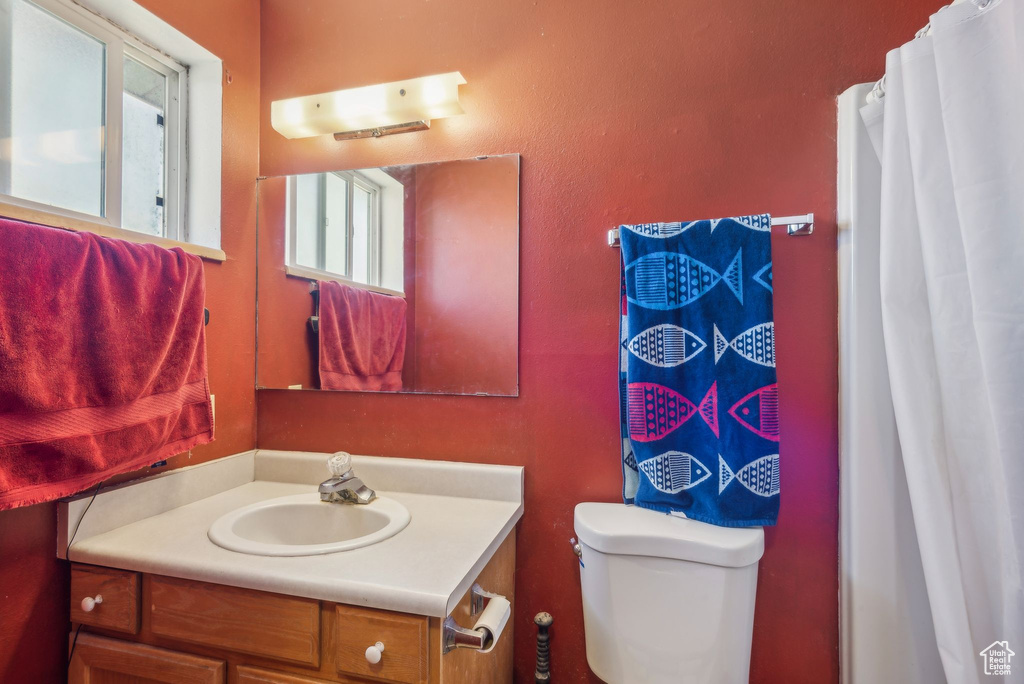 Bathroom featuring vanity and toilet