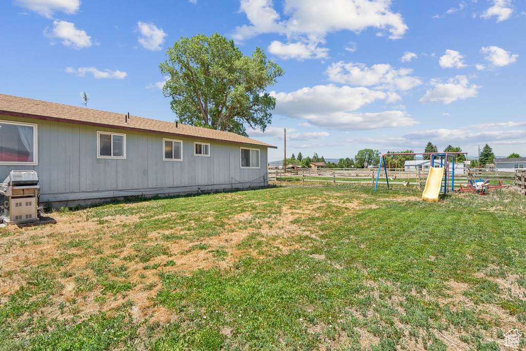 View of yard with a playground