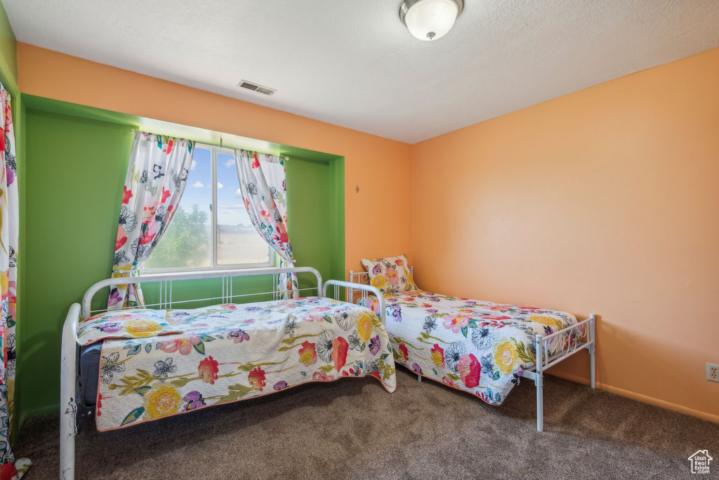 Bedroom with carpet flooring