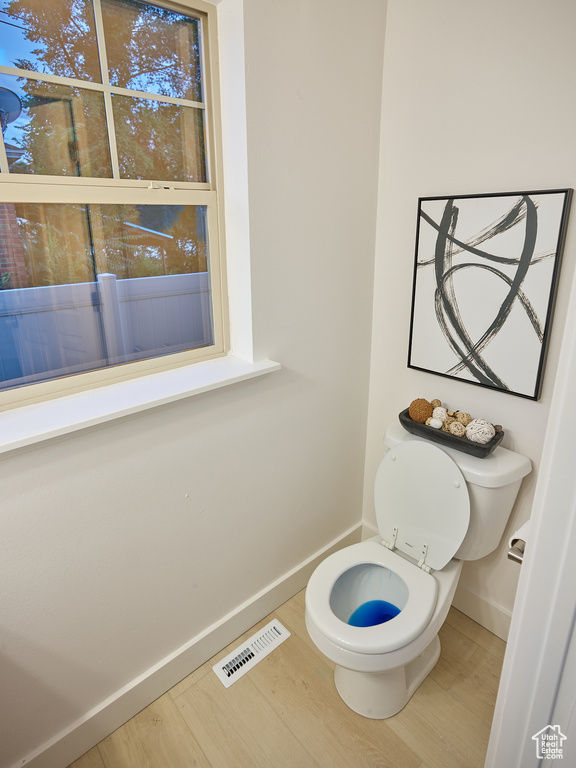 Bathroom featuring baseboards and wood finished floors