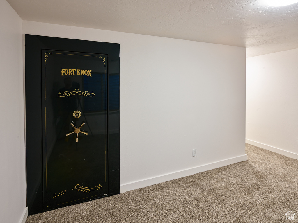 Detailed view of carpet floors and baseboards