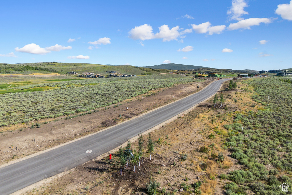 View of road with a view of rural / pastoral area and a mountain view