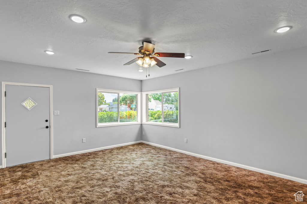 Spare room with ceiling fan, carpet floors, recessed lighting, and a textured ceiling