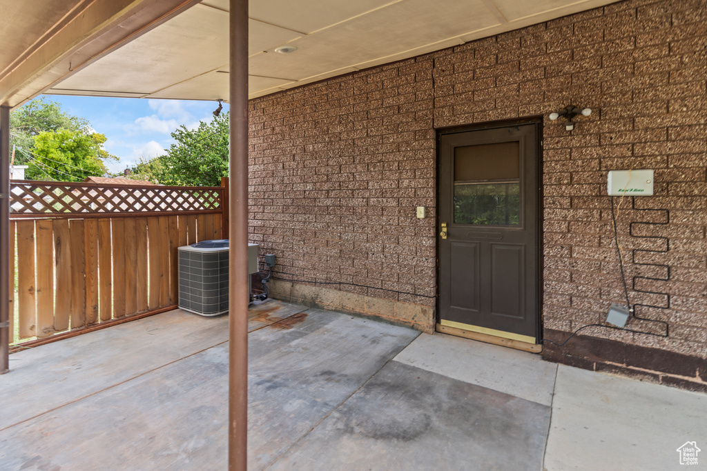 Doorway to property with brick siding