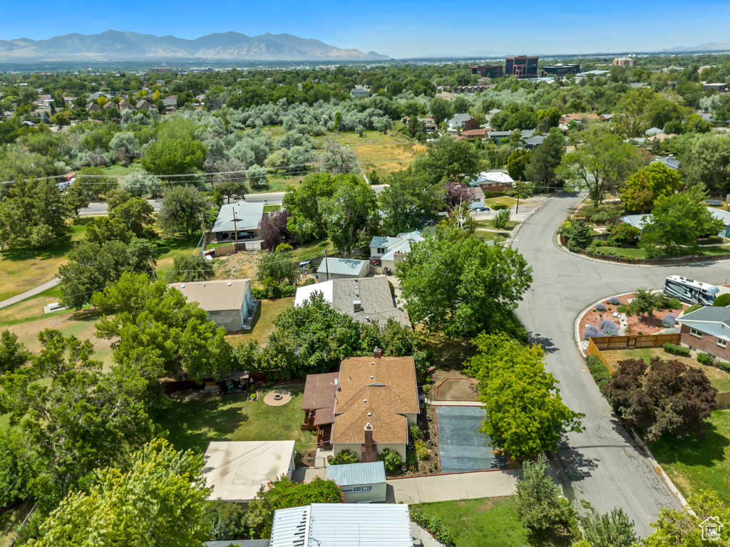 Aerial perspective of suburban area with a mountainous background