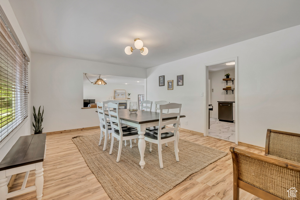 Dining room featuring light wood-style floors and baseboards