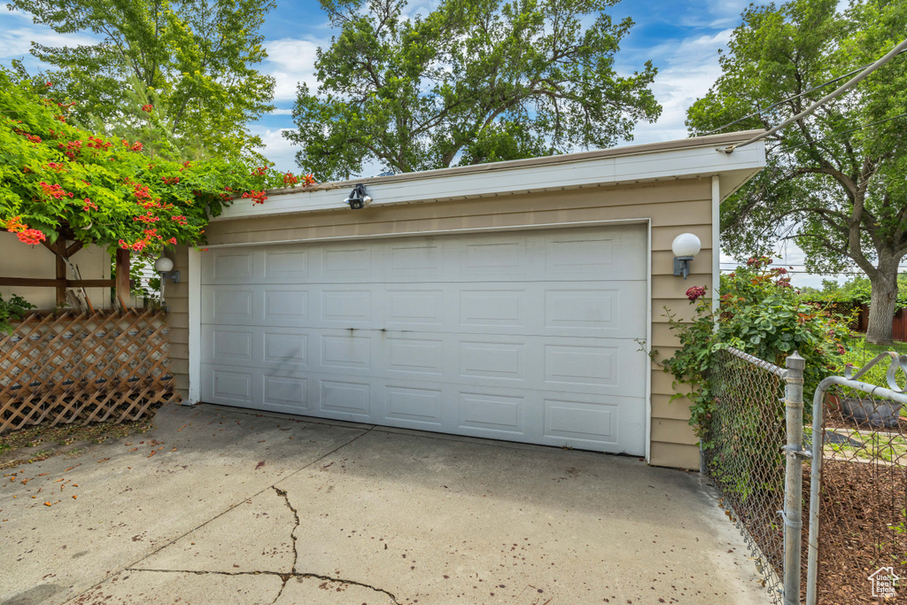 Garage with driveway and a gate