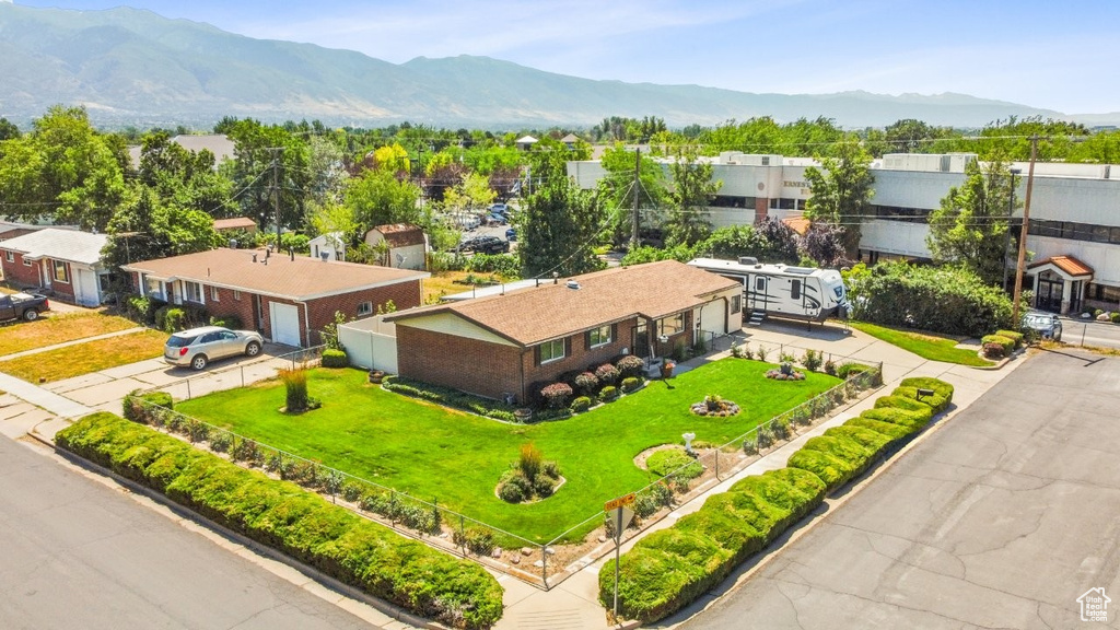 Aerial perspective of suburban area featuring a mountainous background