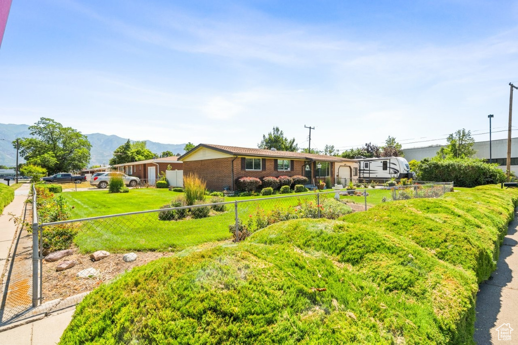 View of front of house featuring a mountain view and brick siding