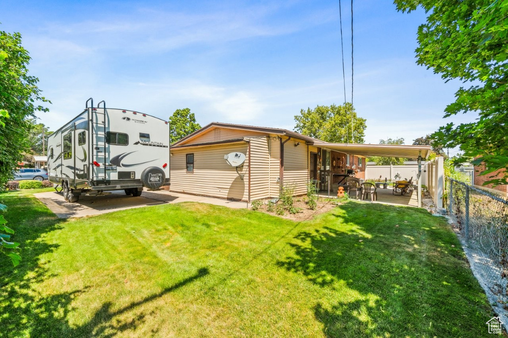 Rear view of property with a patio area