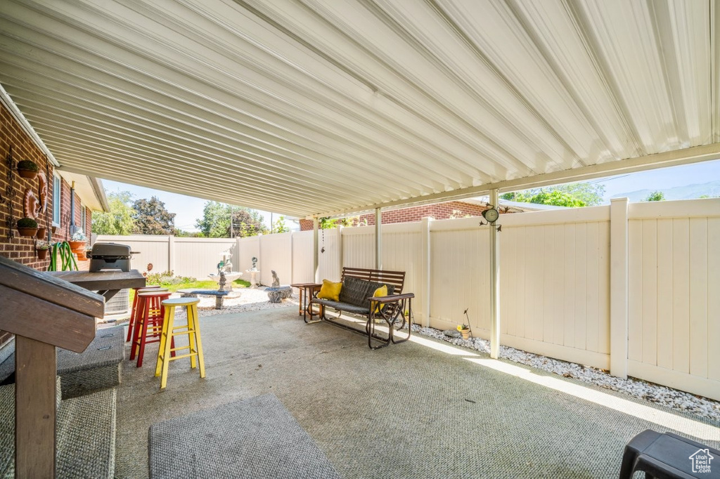 Fenced backyard featuring a patio