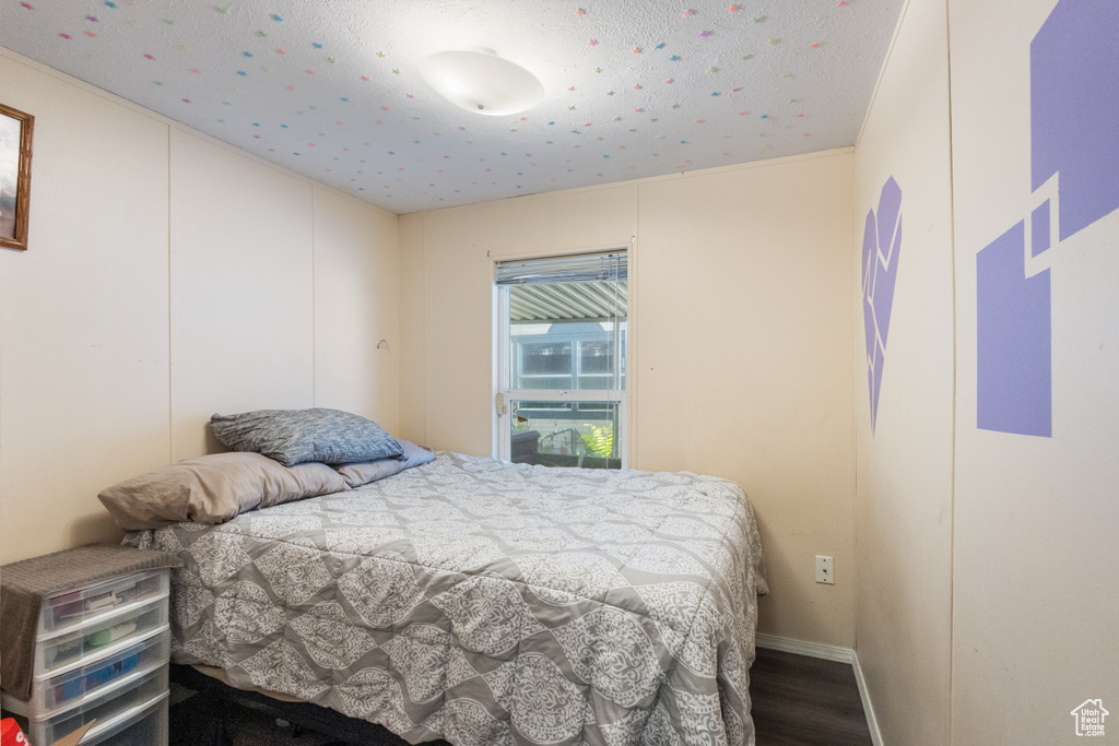 Bedroom with wood finished floors