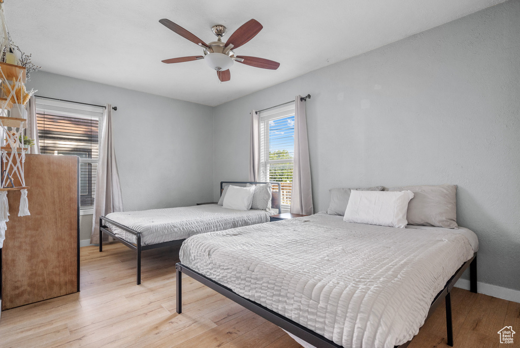 Bedroom featuring light wood-style flooring and ceiling fan