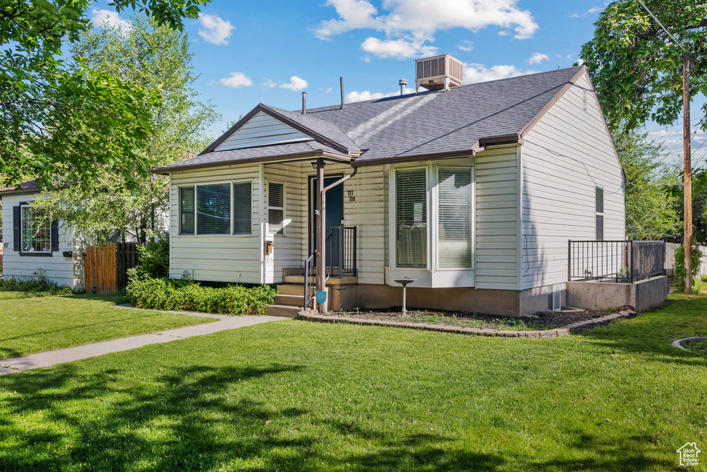 Bungalow-style home featuring roof with shingles