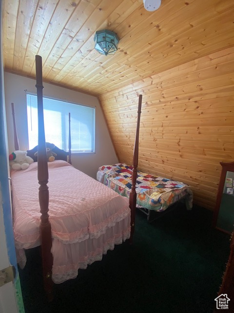 Bedroom with wood ceiling and lofted ceiling