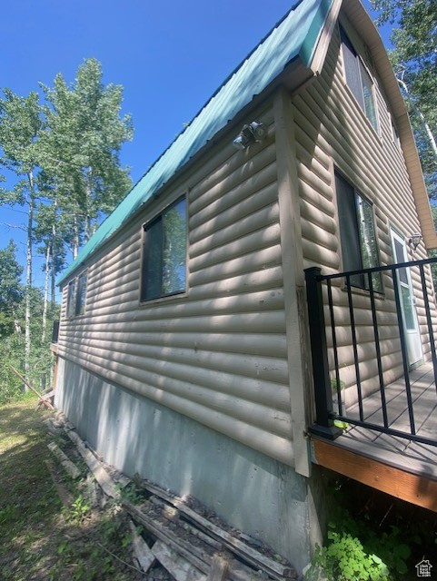 View of home\'s exterior with faux log siding