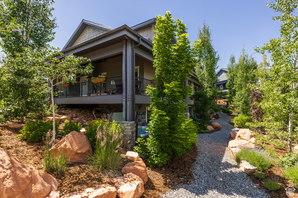View of side of property featuring a balcony