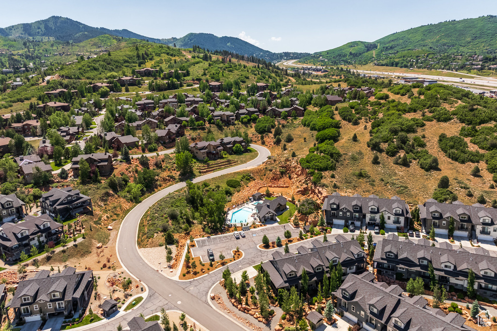 Aerial view of residential area featuring mountains