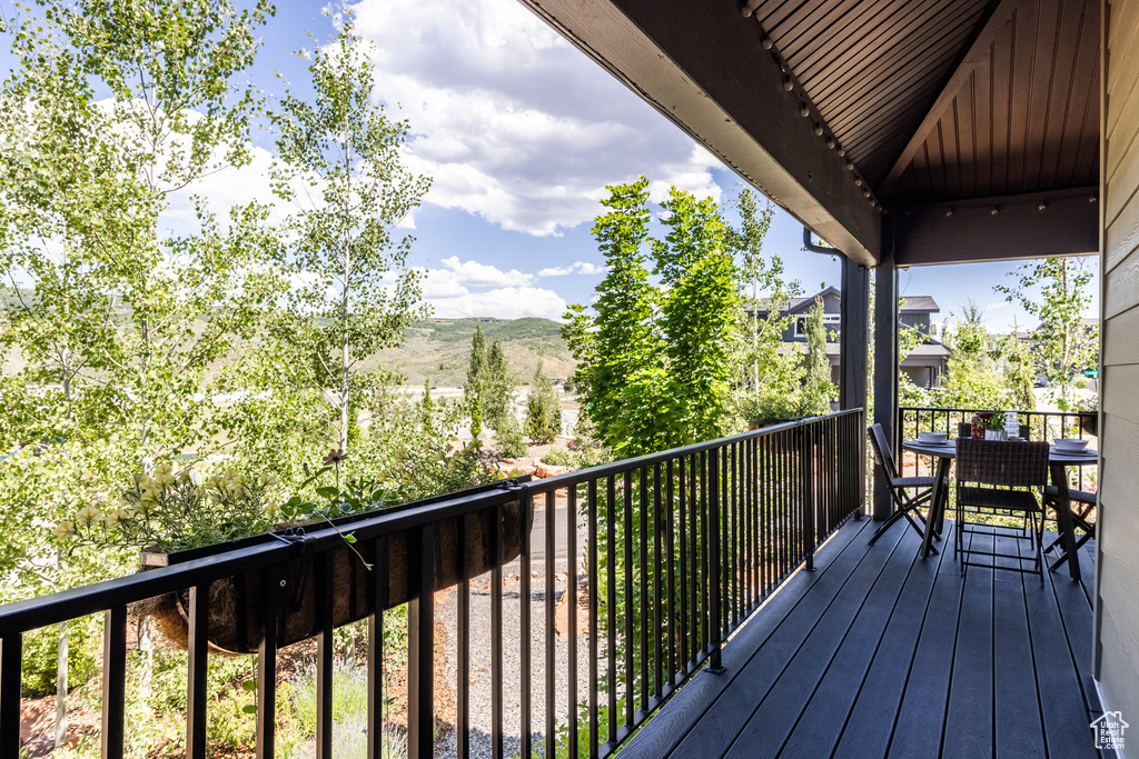 Wooden deck featuring a mountain view