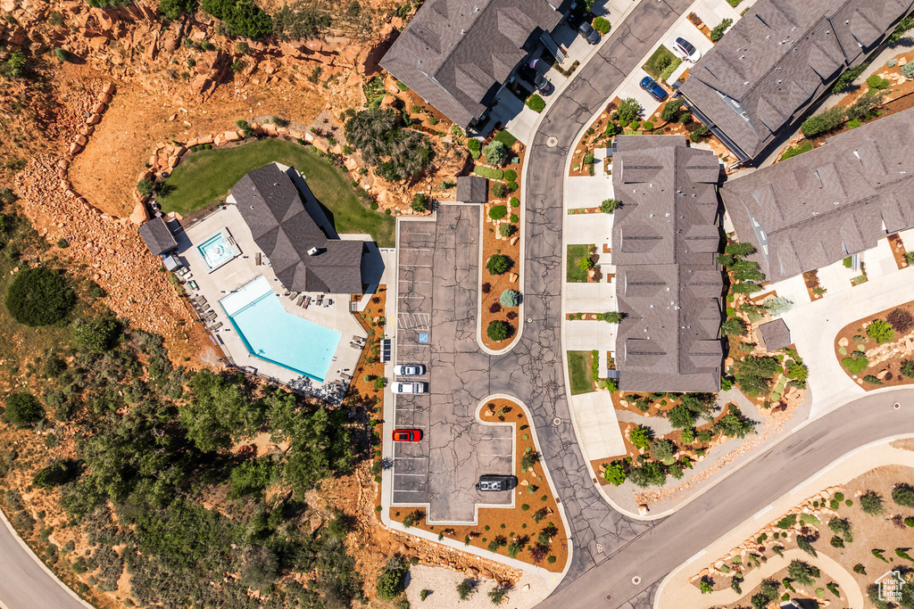 Aerial perspective of suburban area with a pool
