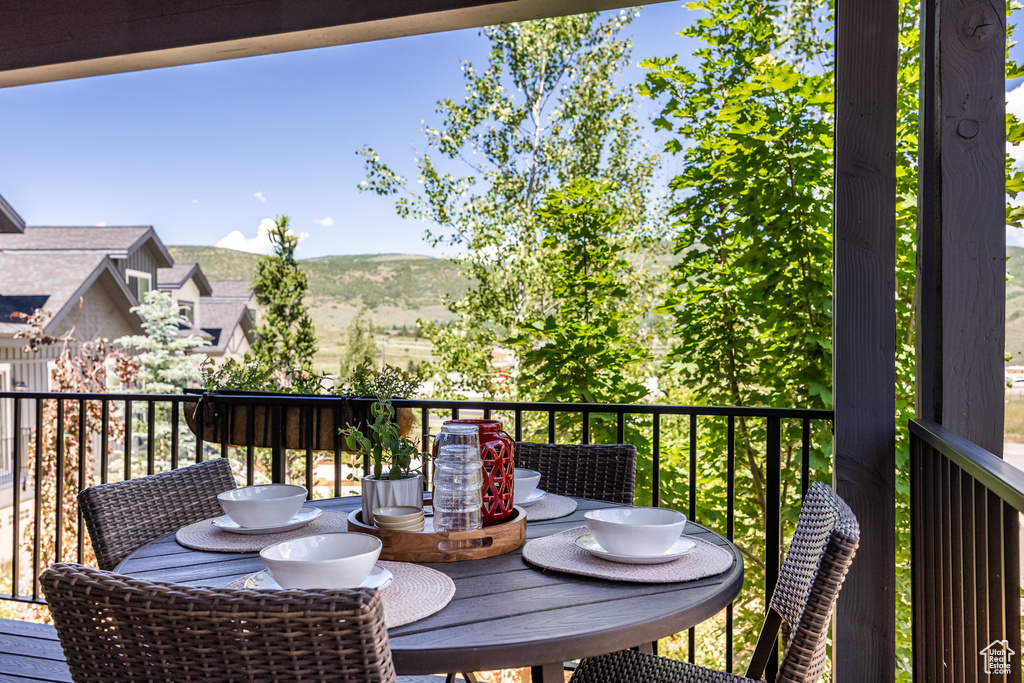 Wooden terrace featuring a mountain view