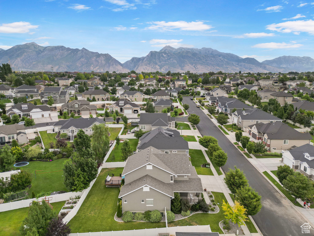 Aerial perspective of suburban area featuring a mountain backdrop