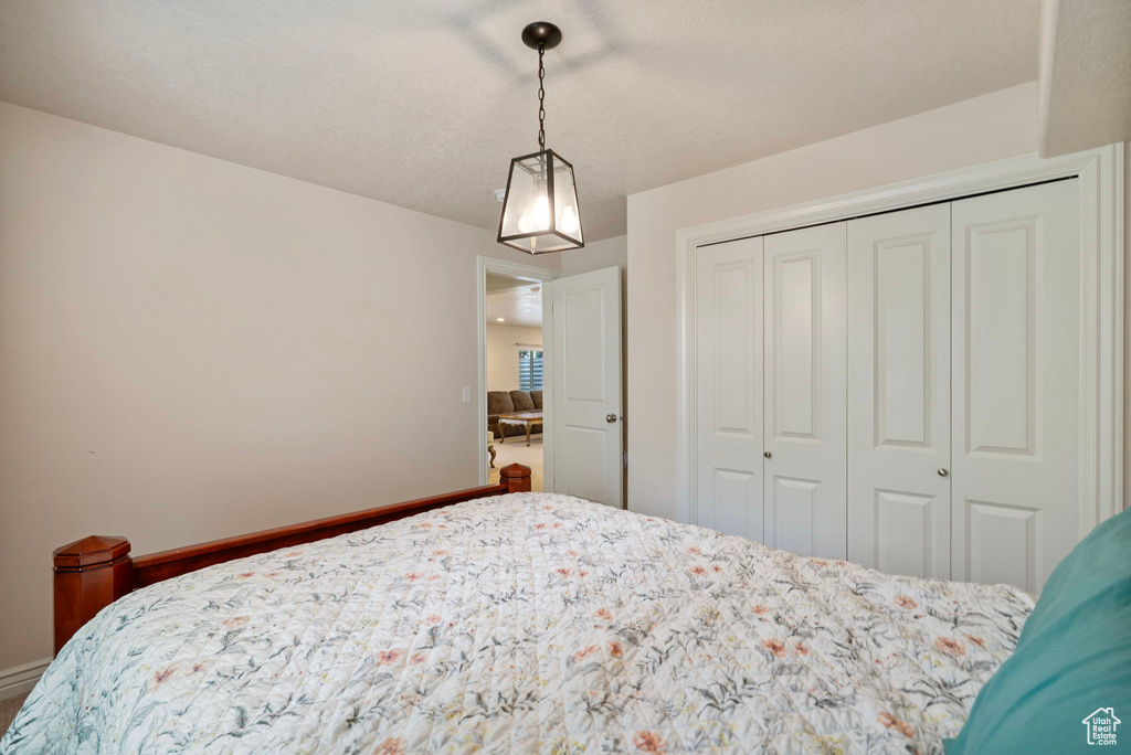Bedroom with a closet and baseboards