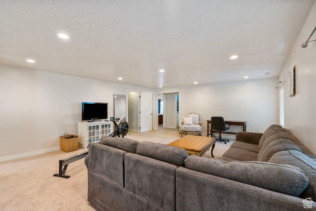 Living room featuring light carpet and recessed lighting