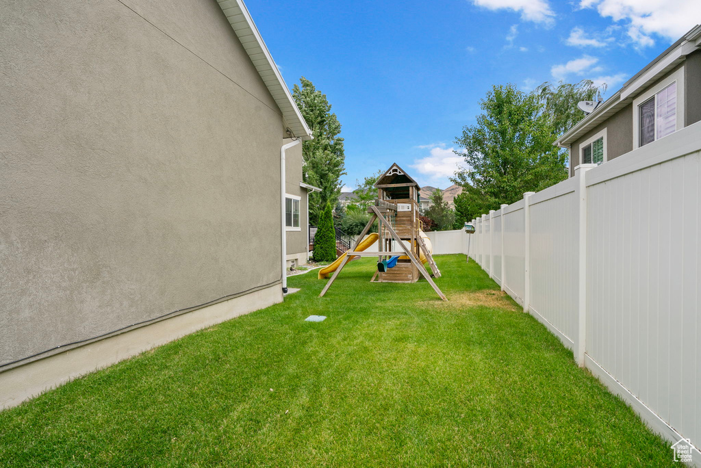 View of yard featuring a playground