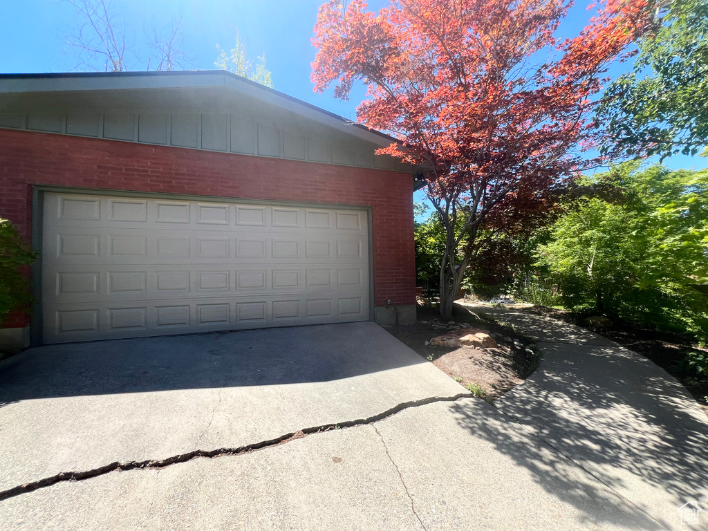Garage with concrete driveway