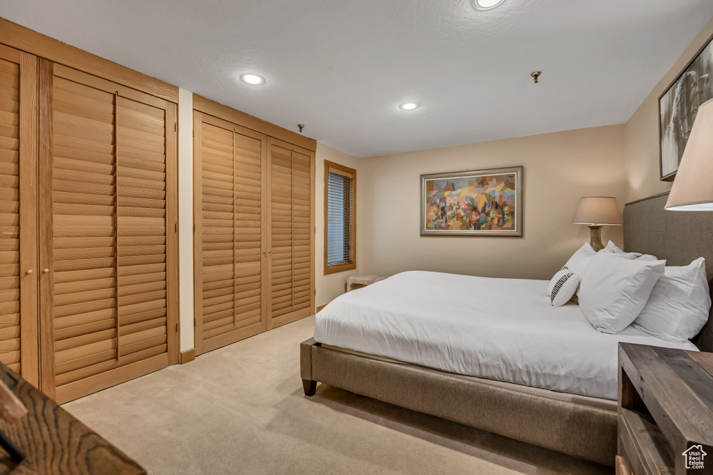Carpeted bedroom featuring recessed lighting