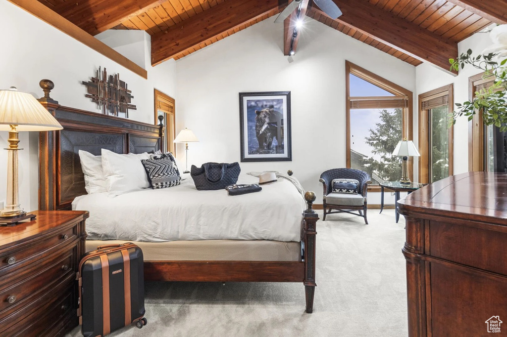 Bedroom with wood ceiling and carpet