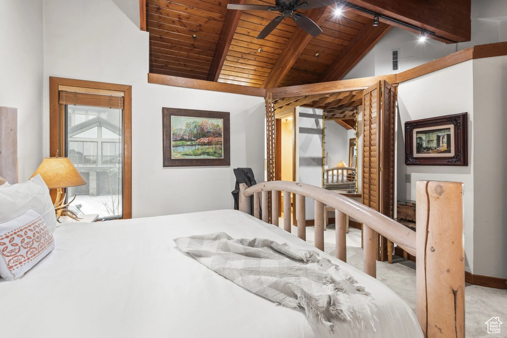 Bedroom featuring wooden ceiling and carpet floors