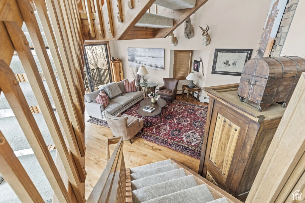 Living room with wood finished floors and stairs