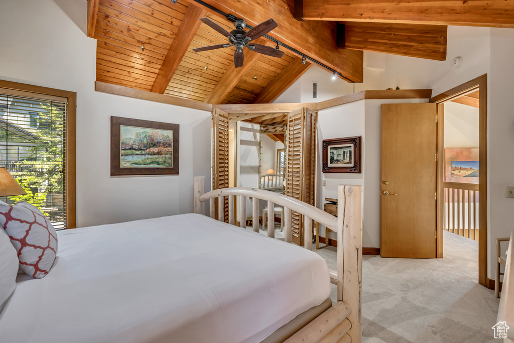 Carpeted bedroom with wooden ceiling