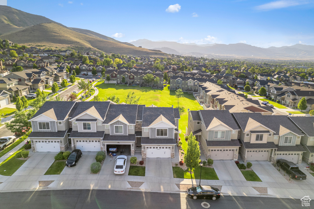 Aerial view of residential area featuring mountains