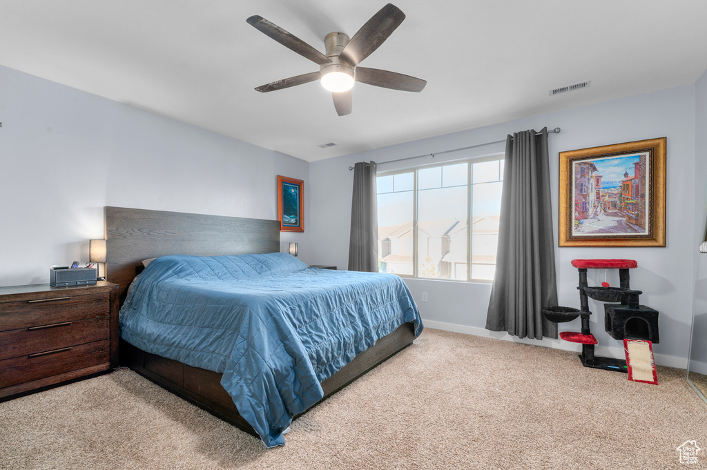 Bedroom with carpet and a ceiling fan