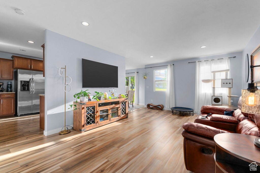 Living room featuring light wood-type flooring and recessed lighting