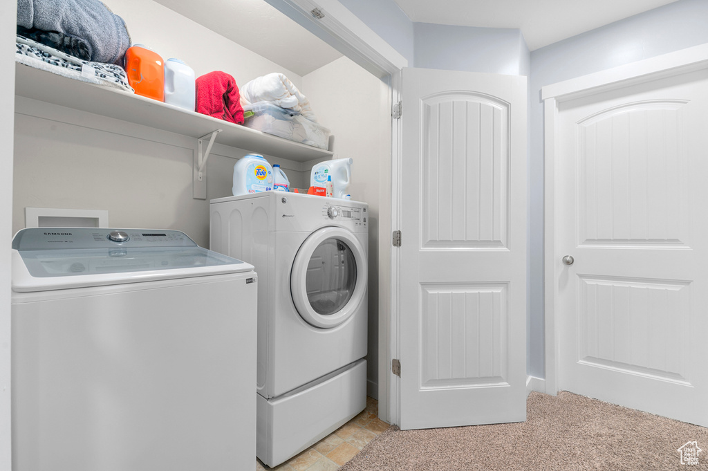 Laundry room featuring independent washer and dryer